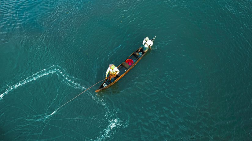 top view of a fishing boat on blue waters