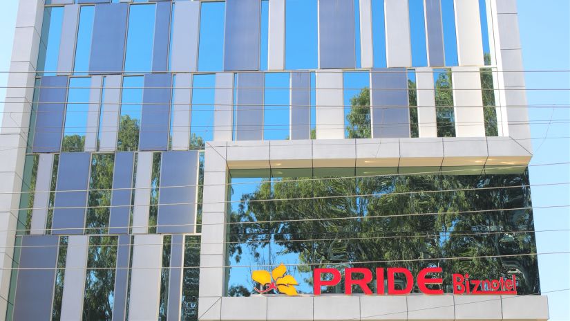 Pride Biznotel Haldwani building with glass exterior