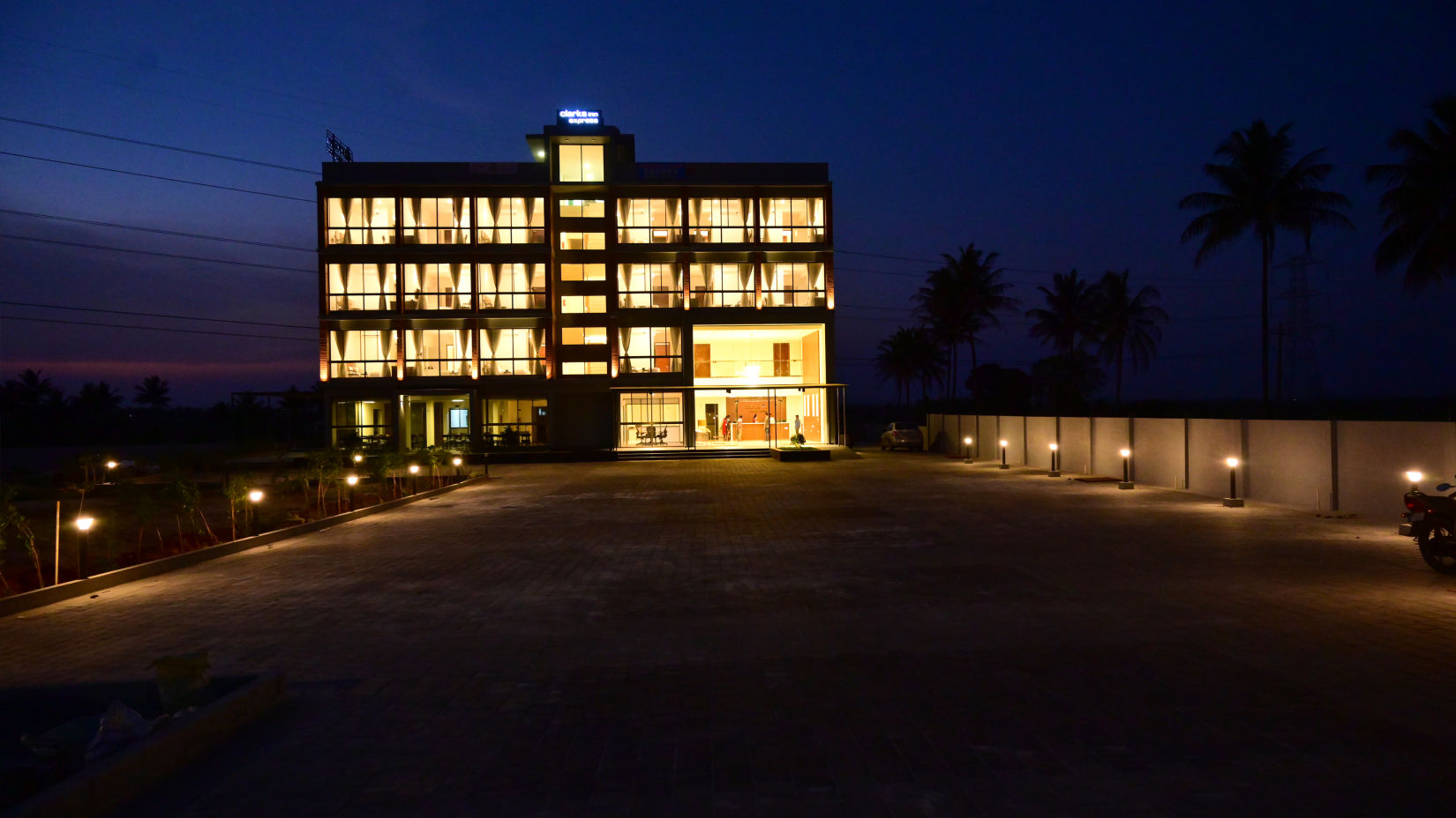 Facade with drive way at night - Clarks Inn Express, KRS Road, Mysore