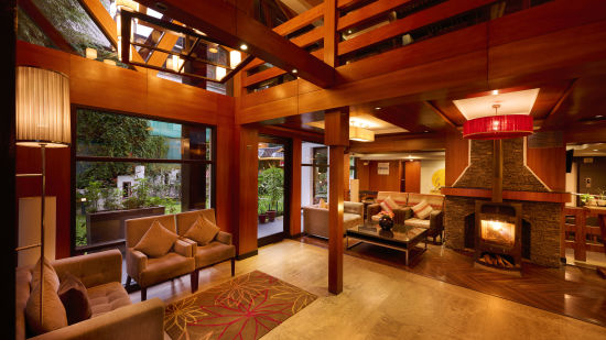 Renest Hotel Manali - Interior view of the waiting area featuring wooden decor