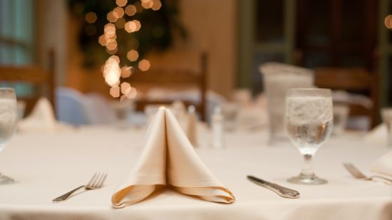 a decorated table in a banquet hall