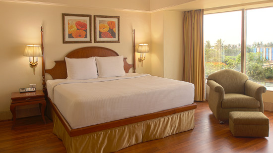 double bed in a Premium Partial Sea View Room at ramada plaza 2