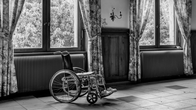 grayscale-photo-of-wheelchair-927690