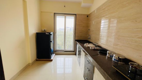 Home2 Suites & Service Apartments, Mumbai Airport - kitchen of our 2BHK standard apartment in Santa Cruz