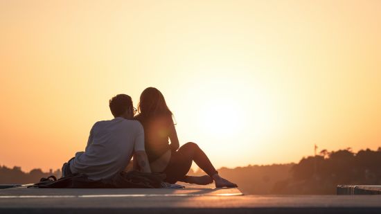 a couple watching a sunset