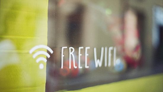 a glass window with free Wi-Fi written on it 