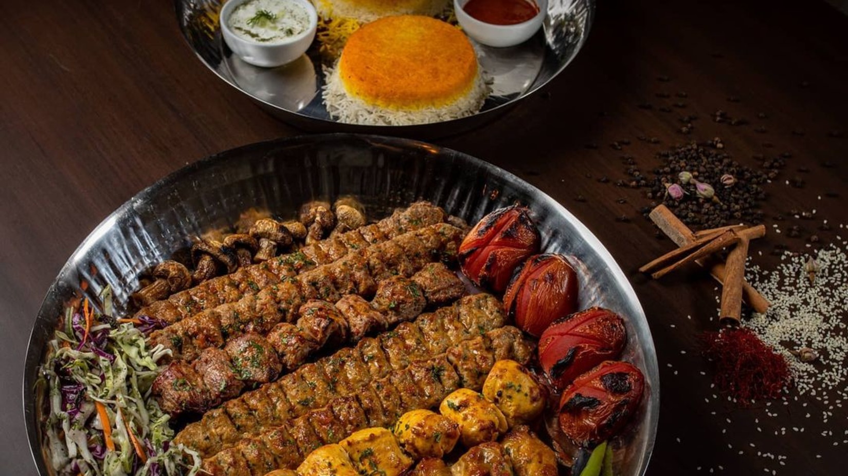 kabab platter next to rice side dish