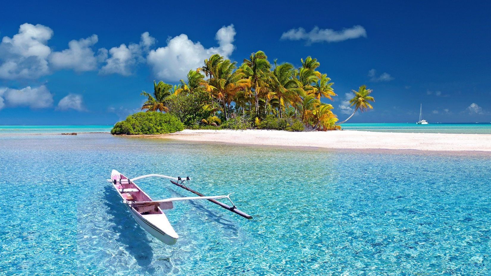 a canoe sailing towards an island with brown sand and blue sky in the background