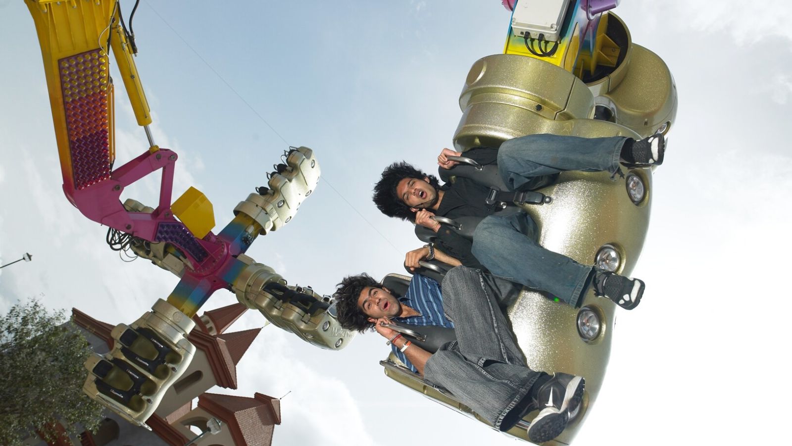 two boys flipped vertically as they ride the Insanity at Wonderla