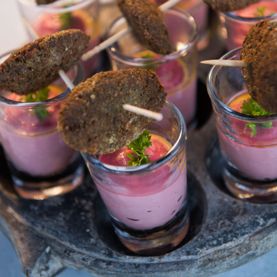 Colourful dish in shot glasses