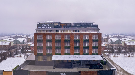 exterior facade of Sarovar Portico Srinagar on a snowy day