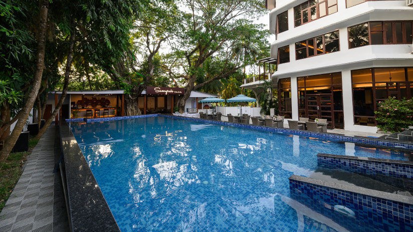 Swimming pool with seating arrangements alongside at Silver Sand Sentinel, Port Blair