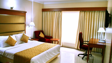 double bed and other amenities in one of our Luxury Rooms in Tirupati at Raj Park Hotel