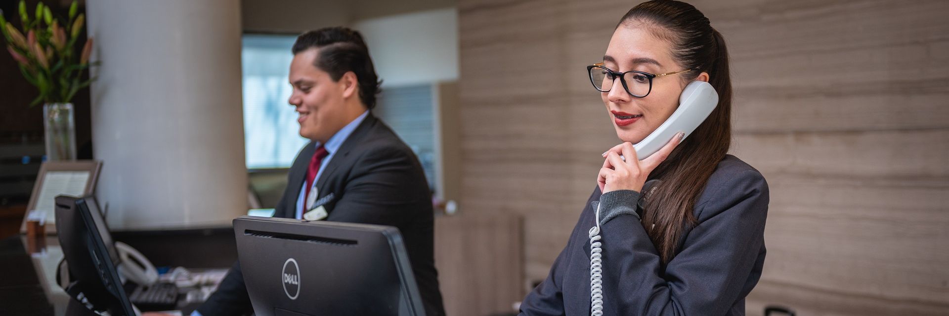 receptionists working at the front desk