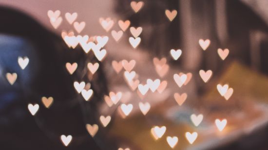 small heart shaped motifs floating on a blurred background