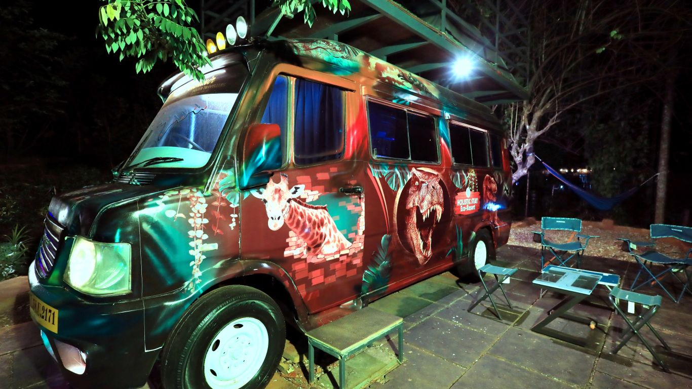 a van with colourful paint at Holistic Stay Eco Resort, Kannur