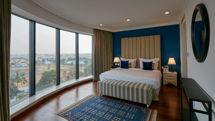 spacious suites with large windows overlooking the city