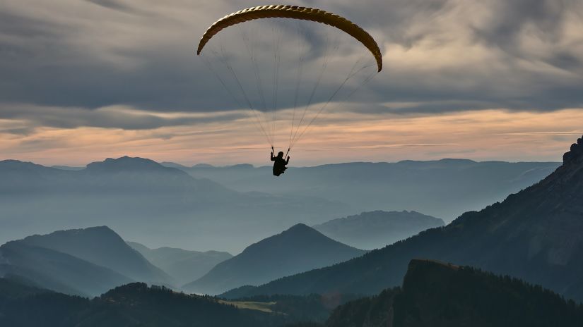 a person paragliding near mumbai