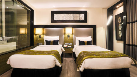 The Empresa Boutique Hotel - the twin beds offered by the Executive twin room in Andheri