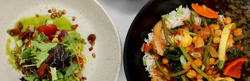 Top-down view of three dishes, including a salad with nuts, a lentil soup with lemon, and a stir-fried vegetable dish with rice.