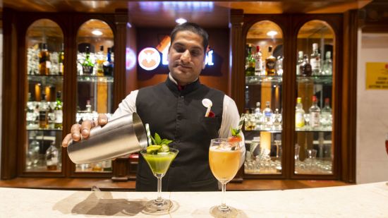 a mixologist working at bar at Mastiff Grand, Manali