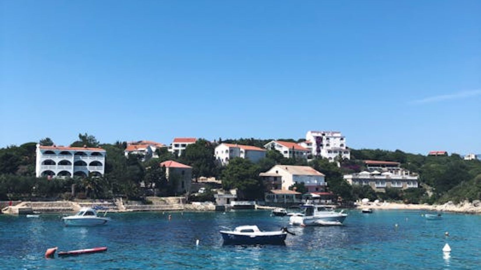 free-photo-of-boats-on-seashore-near-coastal-town-in-croatia