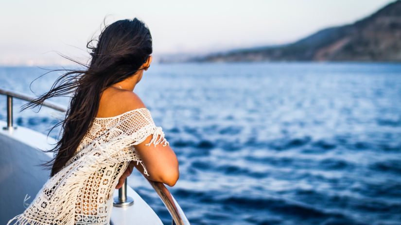 a woman standing on a cruise