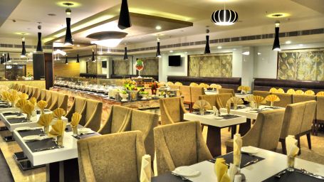 seating area at the Restaurant at Raj Park Hotel in Alwarpet, Chennai