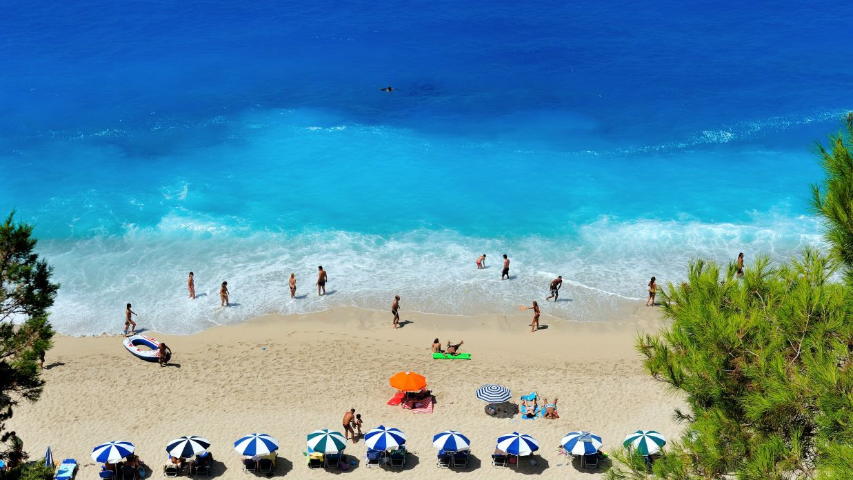 a beach shore with blue water