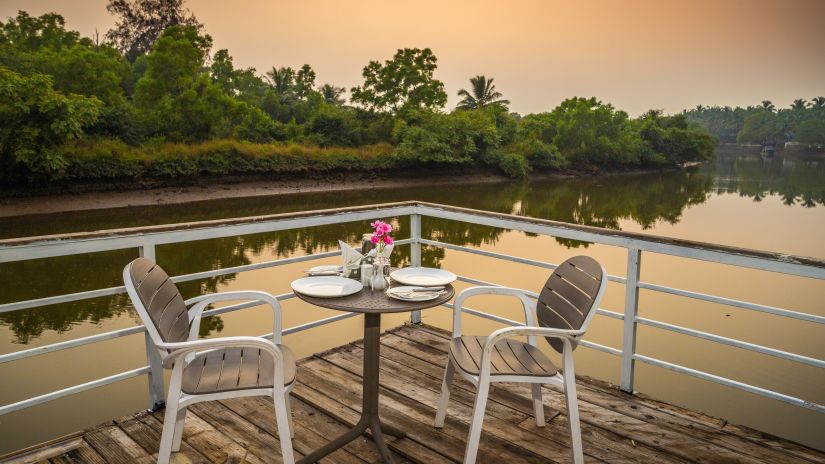 Evening Sunset at the outdoor seating area - Stone Wood Riverfront Resort, Siolim