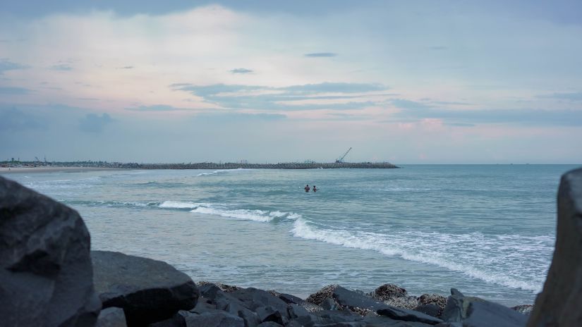 Neemrana's Coconut Alley - sea waves crashing against the seashore