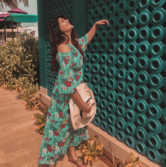 Similing woman wearing a blue floral dress