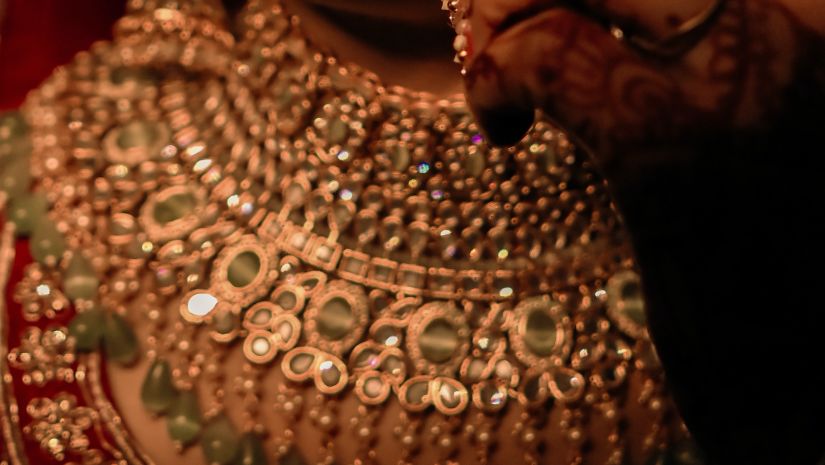 a close up shot of a Woman wearing wedding jewellery