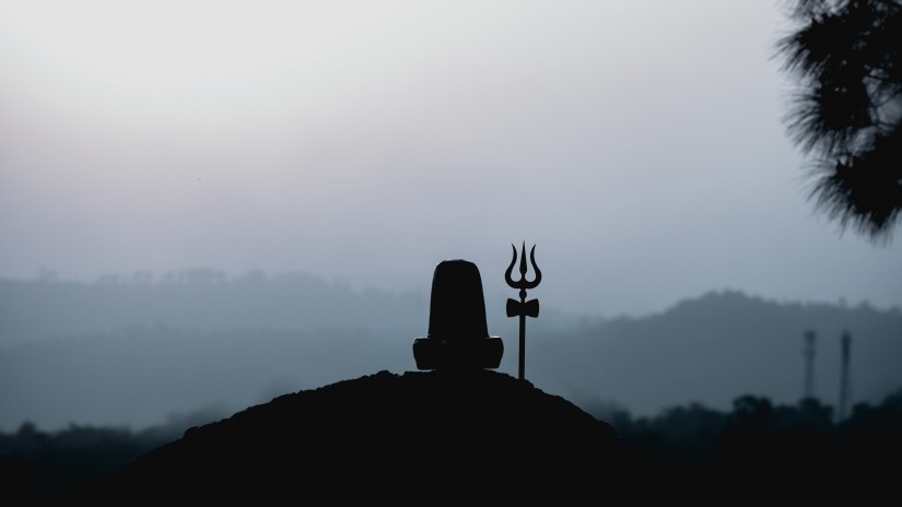 silhouette of a shiv linga with a trishul