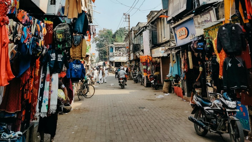 Marketplace with shops and crowd 