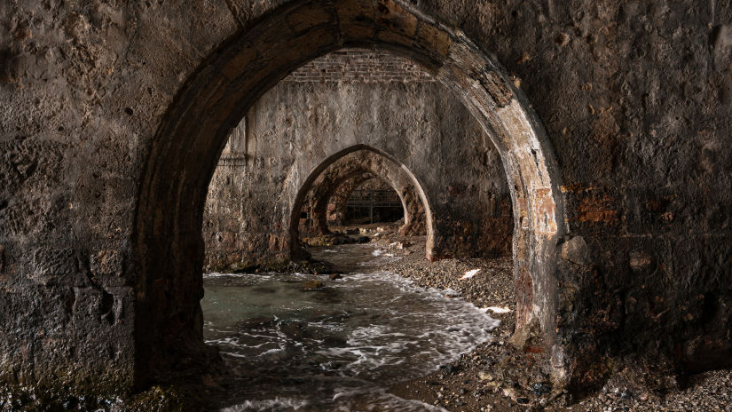 view of an ancient reservoir with tunnels