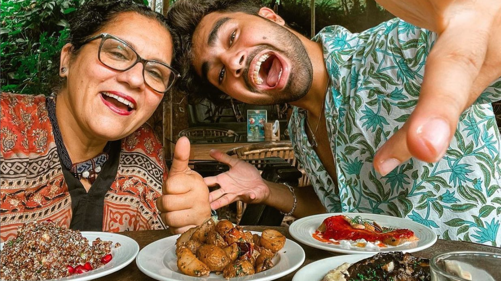 People taking a selfie before a meal