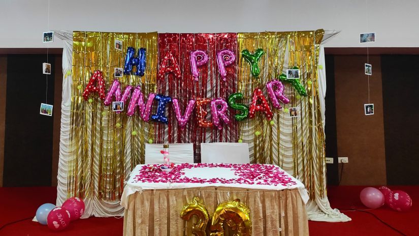 an indoor event venue with anniversary decorations