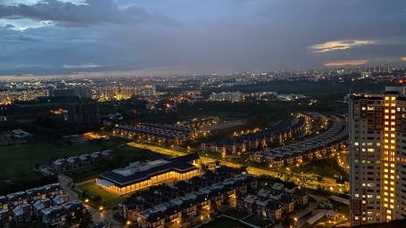 an aerial view of city buildings at night time