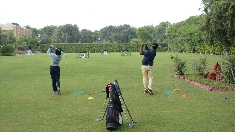 guests playing golf - Heritage Village Resort & Spa, Manesar