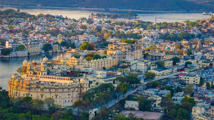  View of Udaipur the City of Lakes located around water lakes and hemmed in lush green hills of Aravallis 