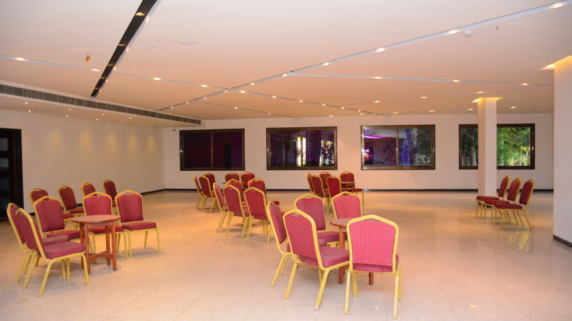 Pride Ranakpur Resort Convention Centre - interior view of the Presidential Hall containing chairs