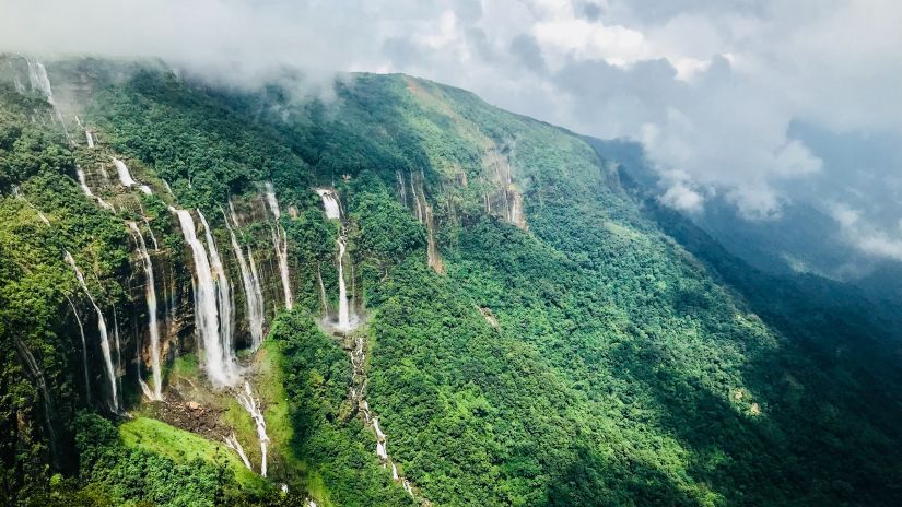 the seven sister waterfall cascading from the lofty mountain peaks of meghalaya