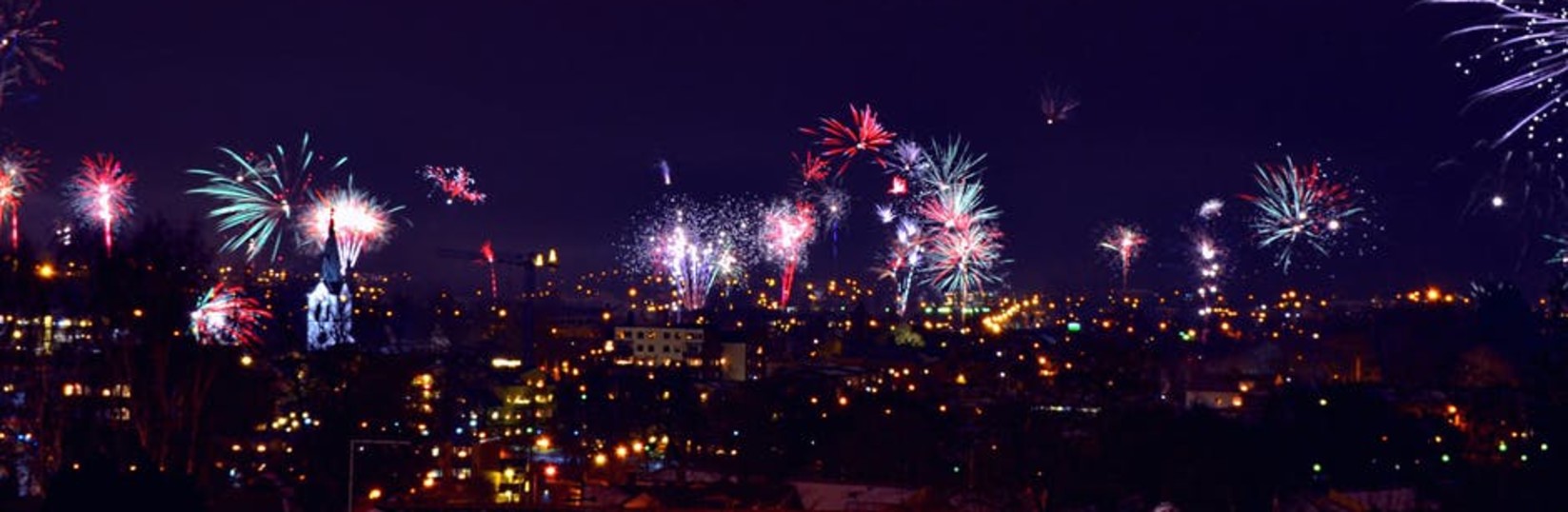 fireworks against a night city skyline