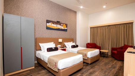 full view of premier rooms with twin beds and posh interiors for a relaxing stay - Mastiff Hotel, Ankleshwar