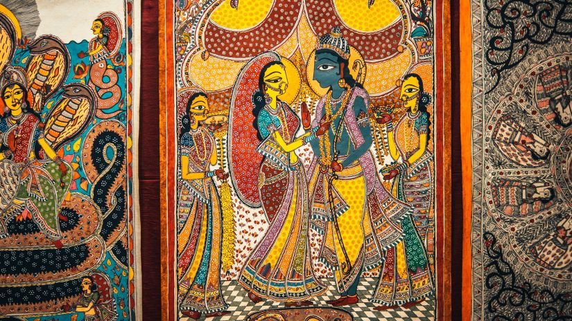 Tradional Indian art featuring Krishna and Radha displayed on a wall - Puri to Konark road trip