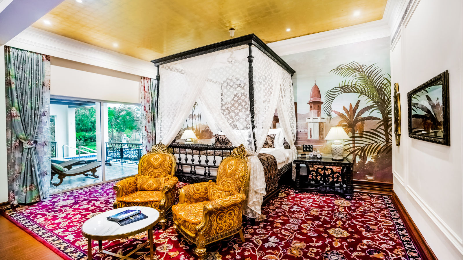 two yellow coloured sofas kept in front of a king size bed - Mayfair Tea Resort, Siliguri 