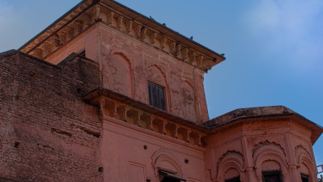 An old rustic building with the blue sky in the background