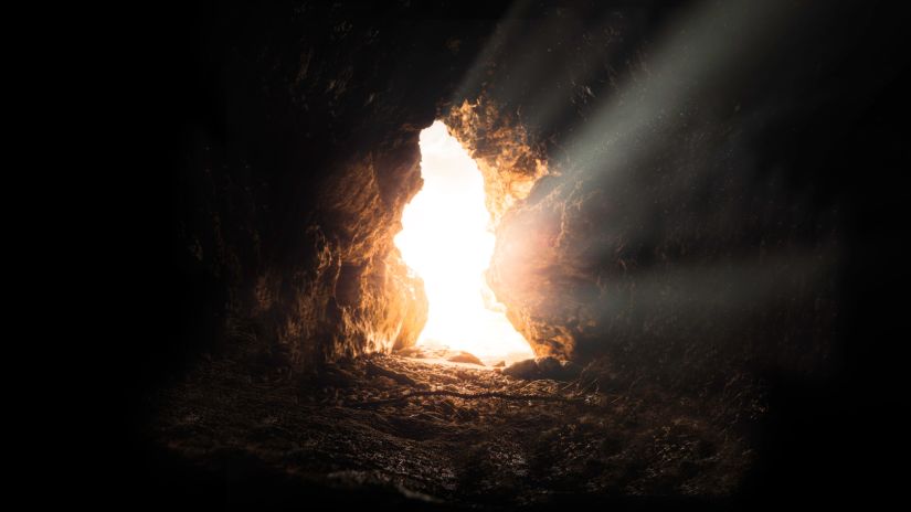 sun shining through an opening in a Cave 2