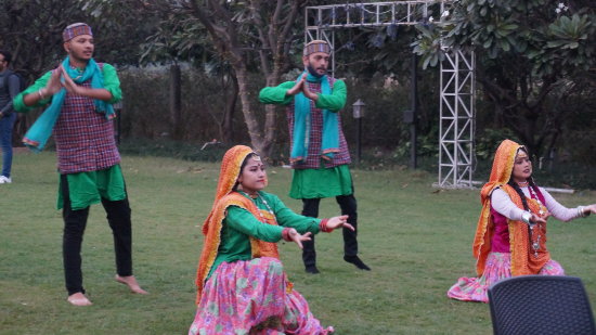 A group of dancers dancing in the lawn at Golden Tusk